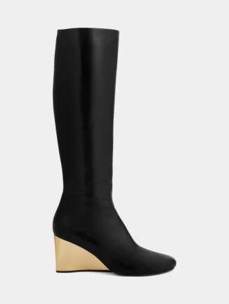 Goldene kniehohe Lederstiefel