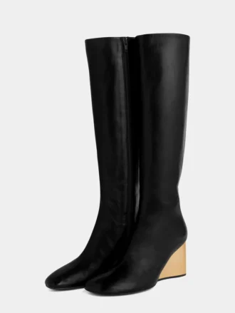 Goldene kniehohe Lederstiefel