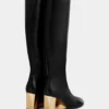 Goldene kniehohe Lederstiefel Goldene kniehohe Lederstiefel