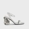 Silberne Sandalen mit glitzernden Scheibenabsätzen