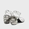 Silberne Sandalen mit glitzernden Scheibenabsätzen